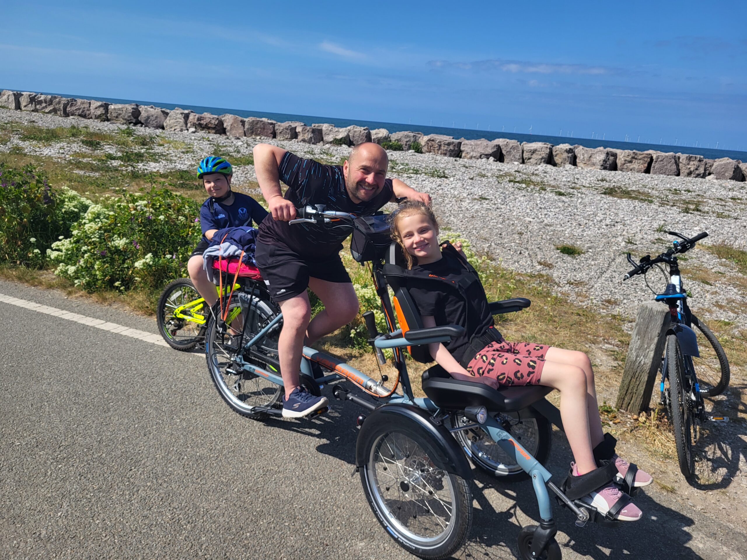 Ruby Grimshaw and her dad using the Van Raam Opair wheelchair bike secured by our Enable Fund