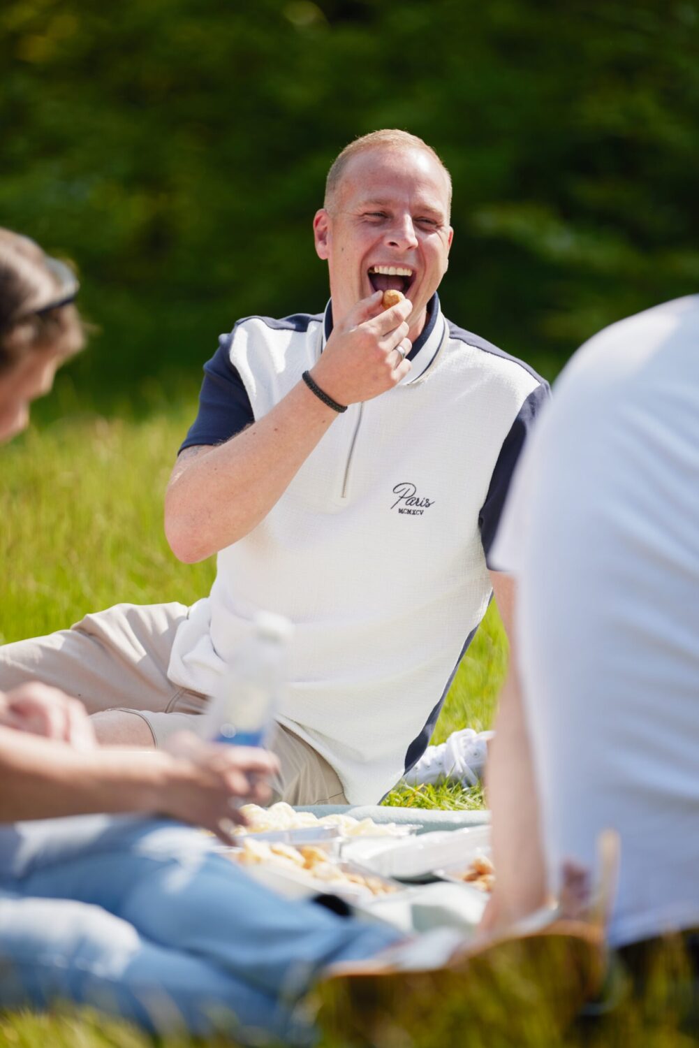 Man laughing at a joke shared in Sefton Park held by the team at Transforming Choice