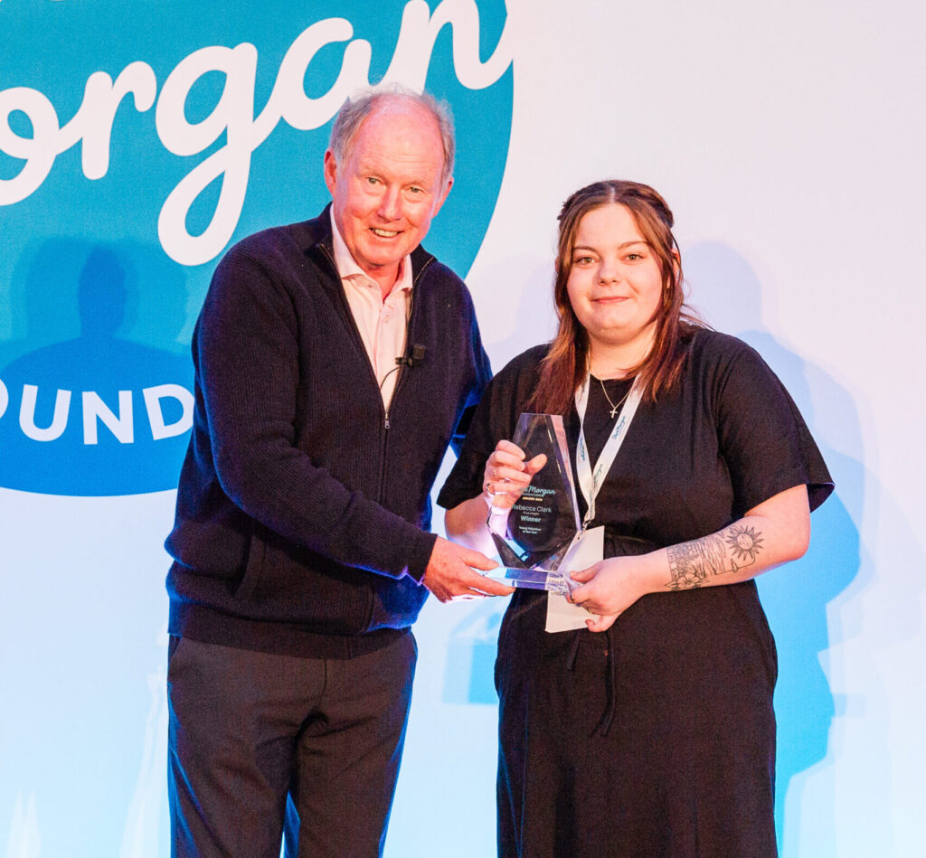 Bex from Pure Insight receiving Volunteer of the Year award from Steve Morgan