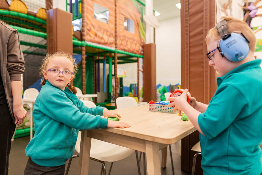 Two children with additional needs playing at SPACE after school club